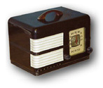 Detrola Radio model 424 with brown bakelite cabinet and white plaskon grille with a handle